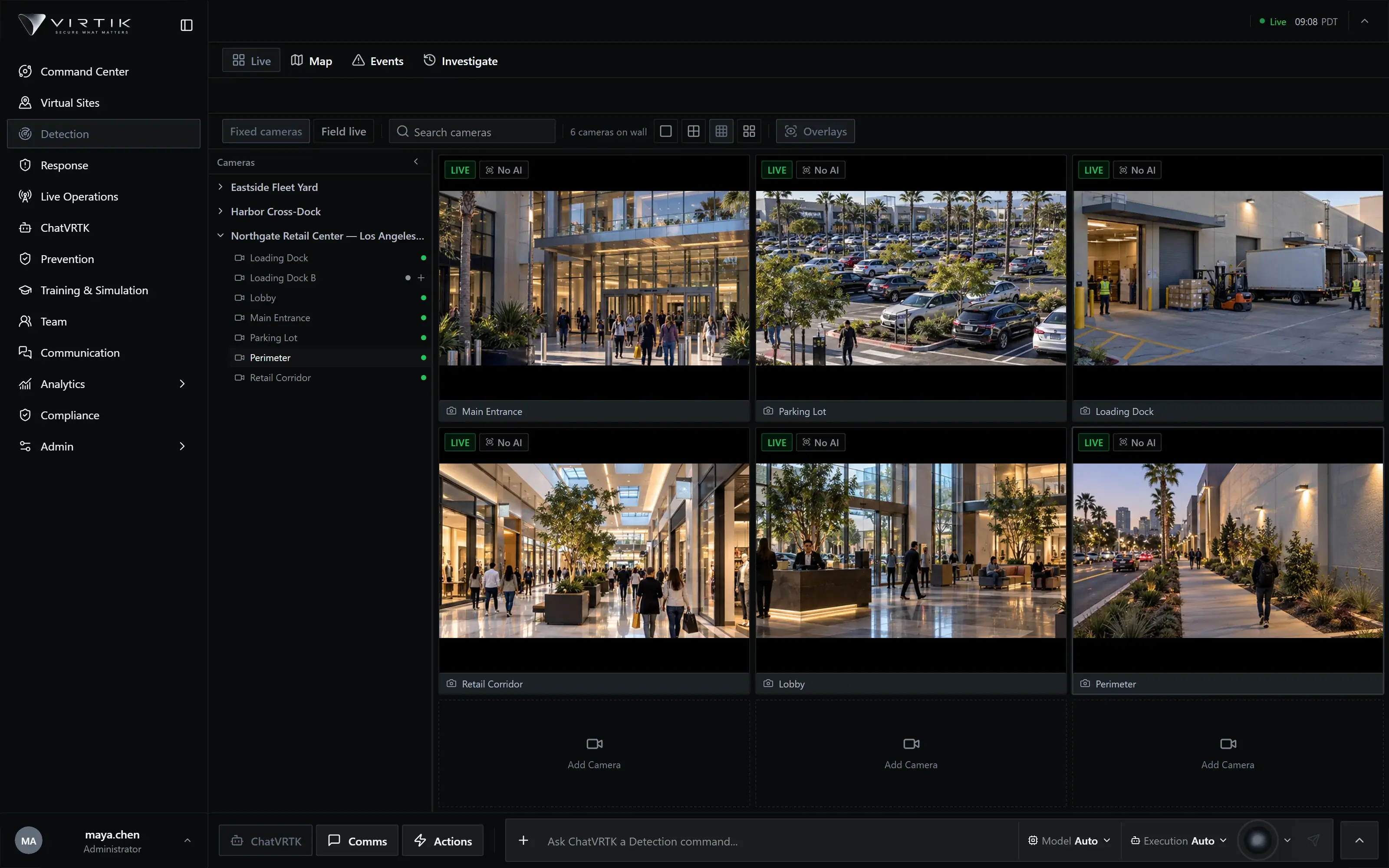Virtik Live Cameras: a wall of six simultaneous camera feeds from a fictional Los Angeles retail center — main entrance, parking lot, loading dock, retail corridor, lobby and perimeter — each tile with a LIVE status and the camera name, beside the site's camera list.